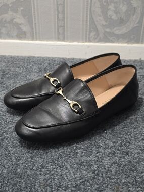 Women's Black Leather Slip-On Loafers with Gold Bit Detail